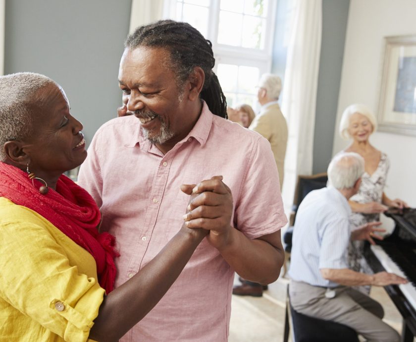 Group Of Seniors Enjoying Dancing Club Together